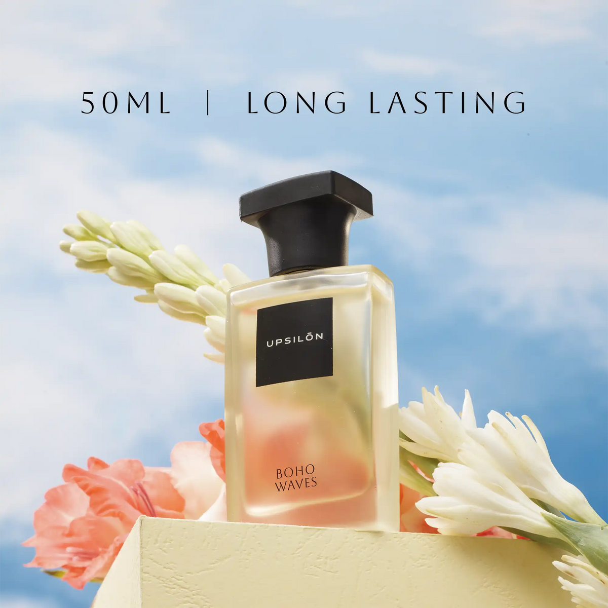 bottle of UPSILON Eau de Parfum in a travel-size gift box, with text describing the fragrance as "long-lasting" and "eau de parfum", 50ml Long lasting