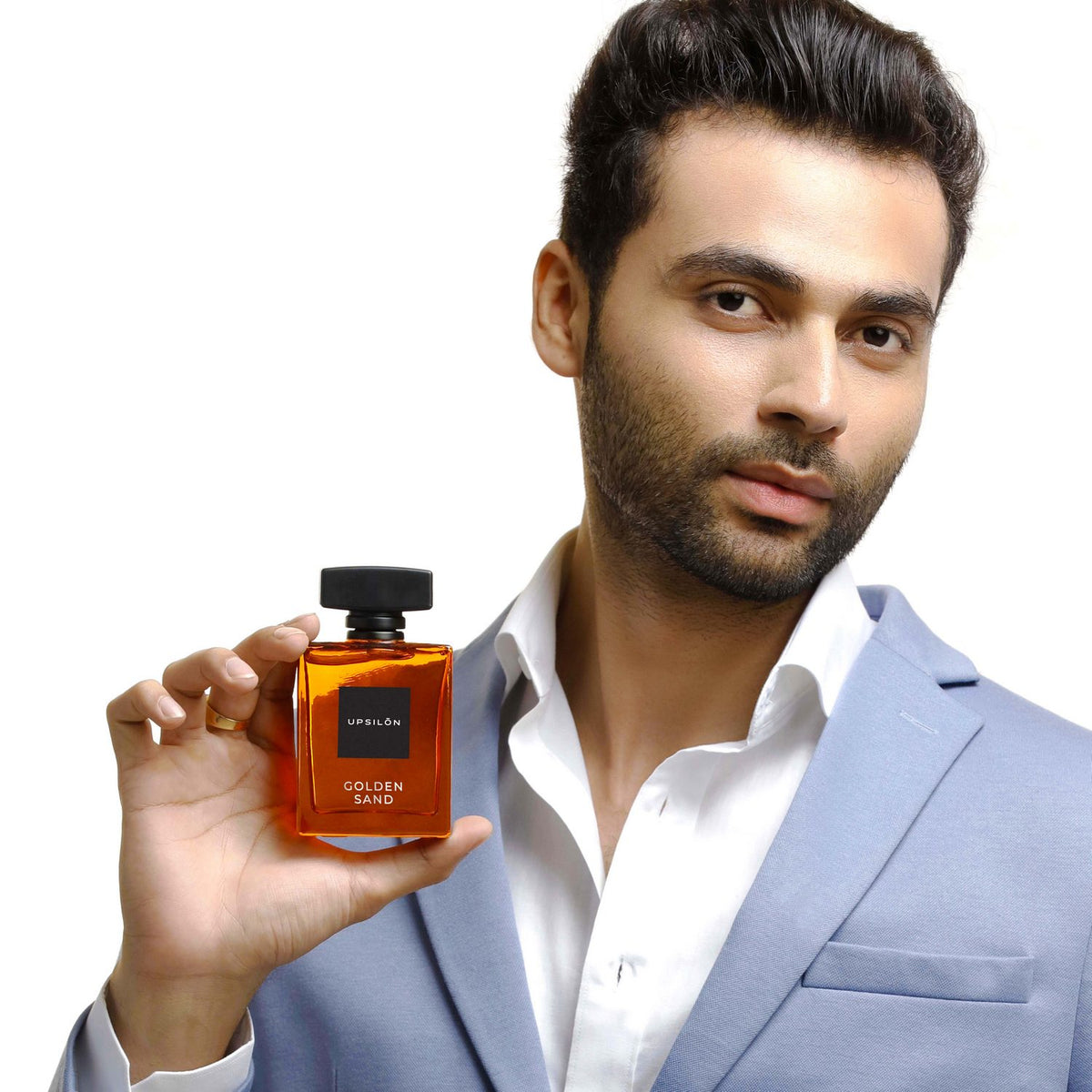 A bottle of UPSILON Golden Sand Eau de Parfum