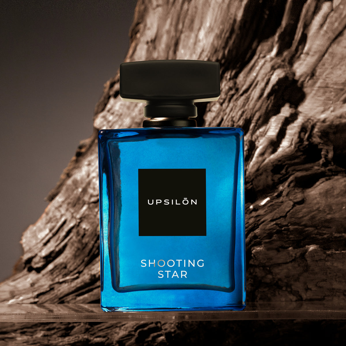 A luxurious bottle of Upsilon Shooting Star Eau de Parfum, a long-lasting and powerful fragrance for men